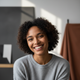 A smiling person's headshot, depicting a happy and satisfied customer.